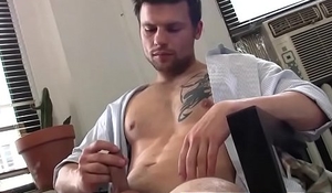 Sexy brunette fellow jerking off his big white dick