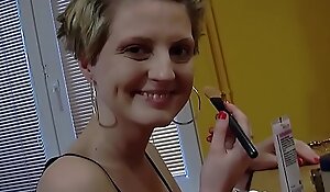 Desirable chick teases while putting on makeup